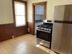 48 Hodges Avenue, Unit 2 Taunton, MA 02780 - Photo 8 of 11 a kitchen with a stove and a cabinet