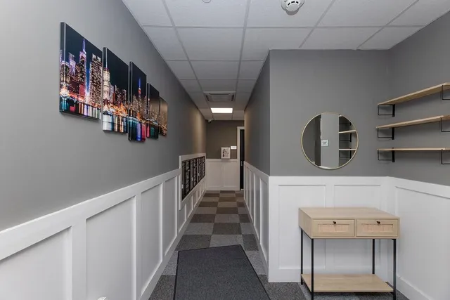 a view of a livingroom with an empty space and a window
