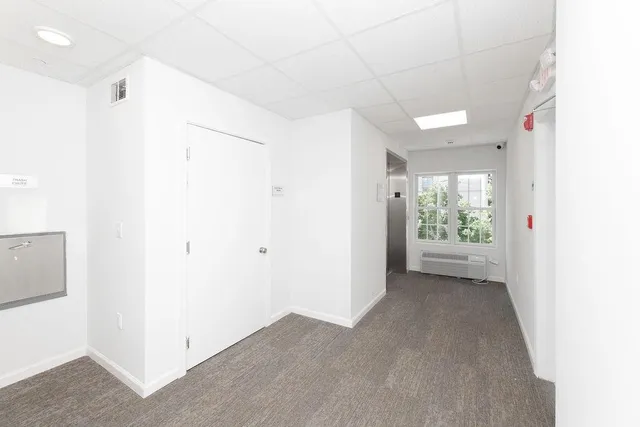 a view of parking garage with cars parked