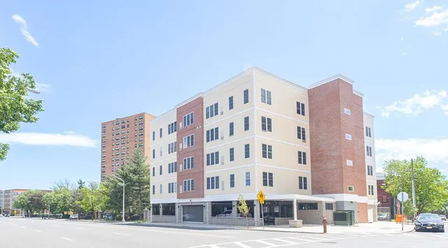 a view of a building with a street