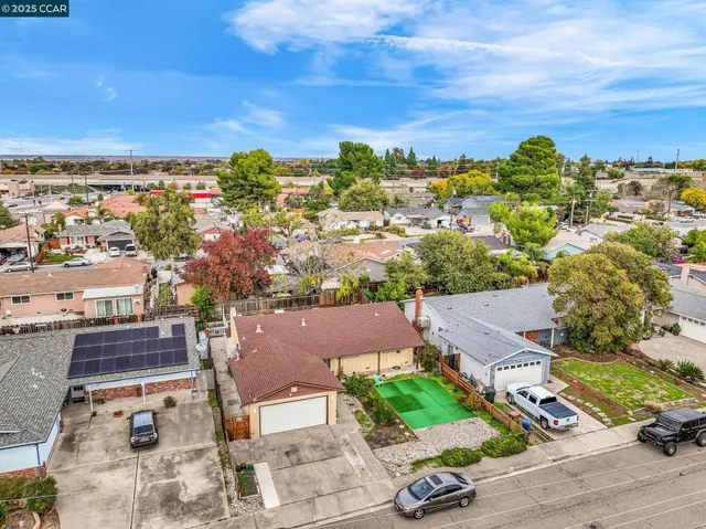 an aerial view of residential houses with outdoor space