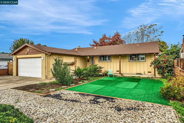 front view of a house with a yard