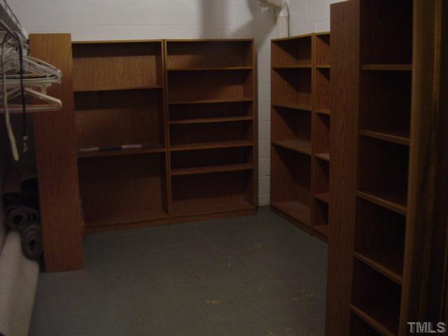 9512 Springdale Drive Raleigh, NC 27613 - Photo 7 of 11 One of the unfinished storage areas in the basement.