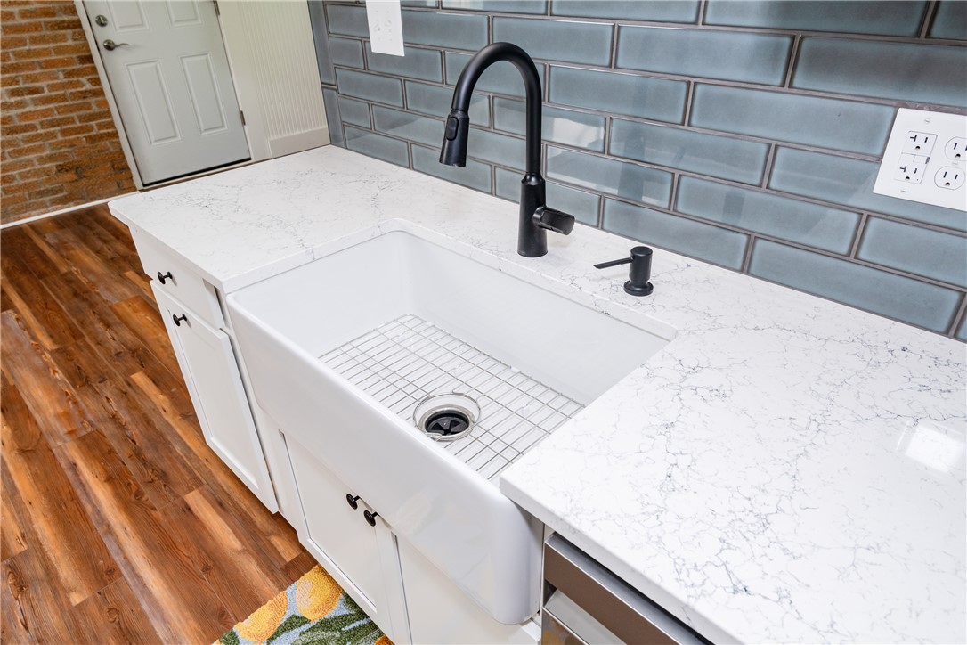 1217 Jasper Road Xenia, OH 45385 - Photo 24 of 62 This bright kitchen features a large sink and beautiful quart countertops.