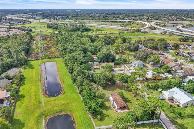 an aerial view of residential houses with outdoor space