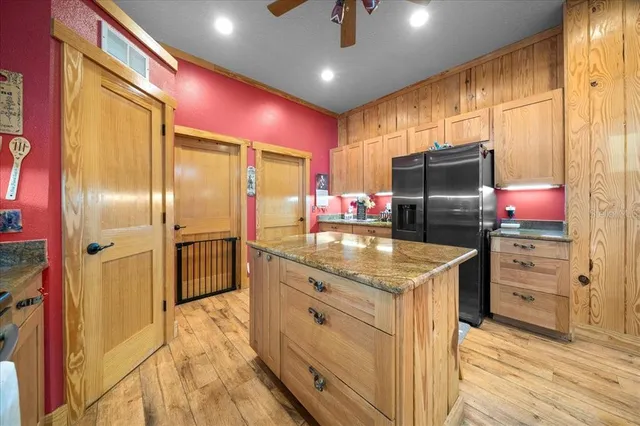 a bed room with furniture and a wooden floor