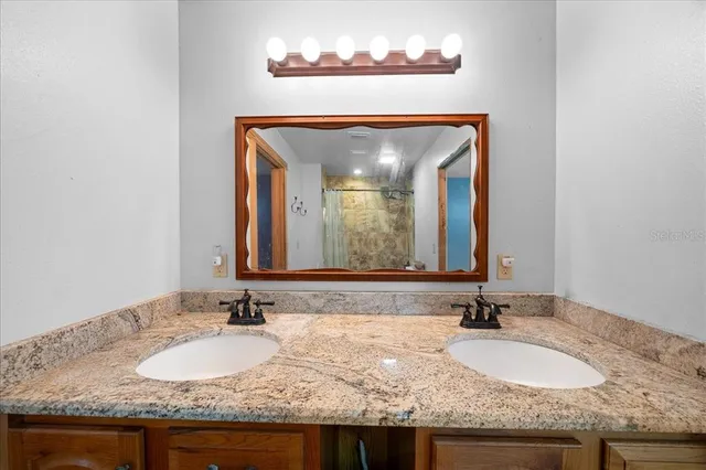 a view of a house with backyard porch and sitting area
