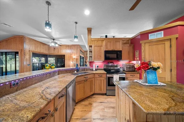 a spacious bedroom with a large bed and a flat screen tv