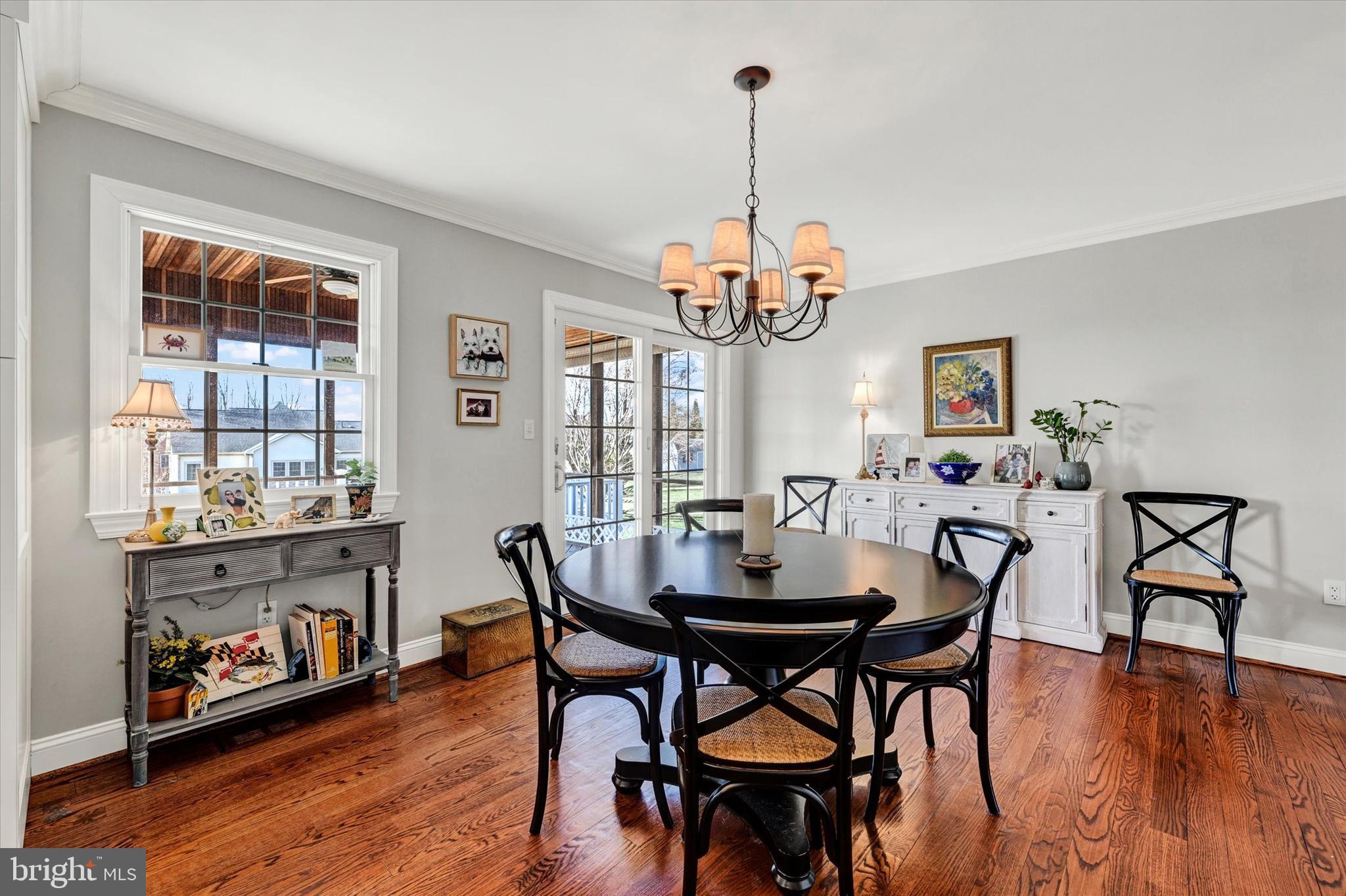 2211 Old Bosley Road Cockeysville, MD 21030 - Photo 11 of 65 a view of a dining room with furniture window and wooden floor