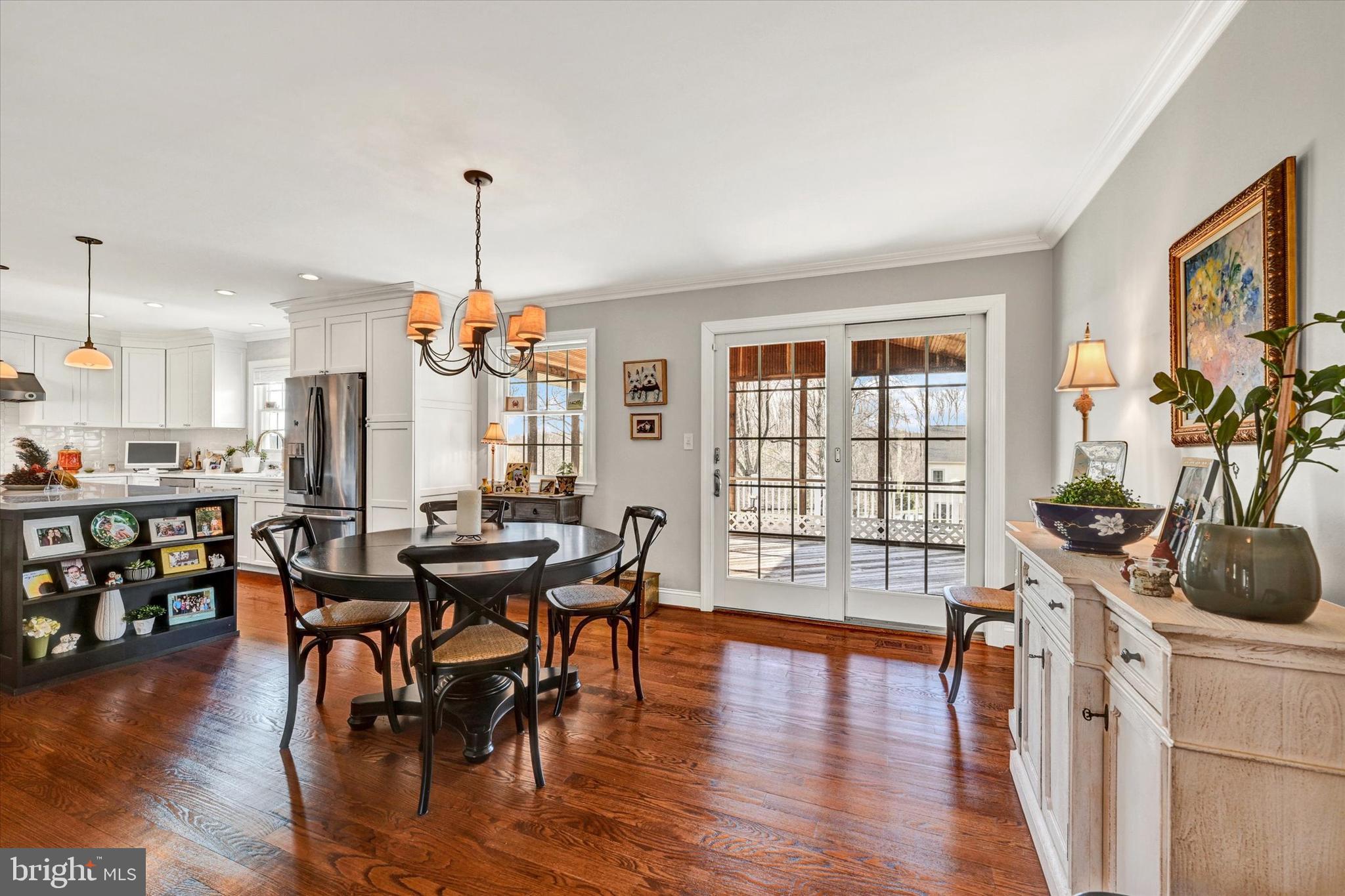 2211 Old Bosley Road Cockeysville, MD 21030 - Photo 12 of 65 a view of a dining room with furniture window and wooden floor