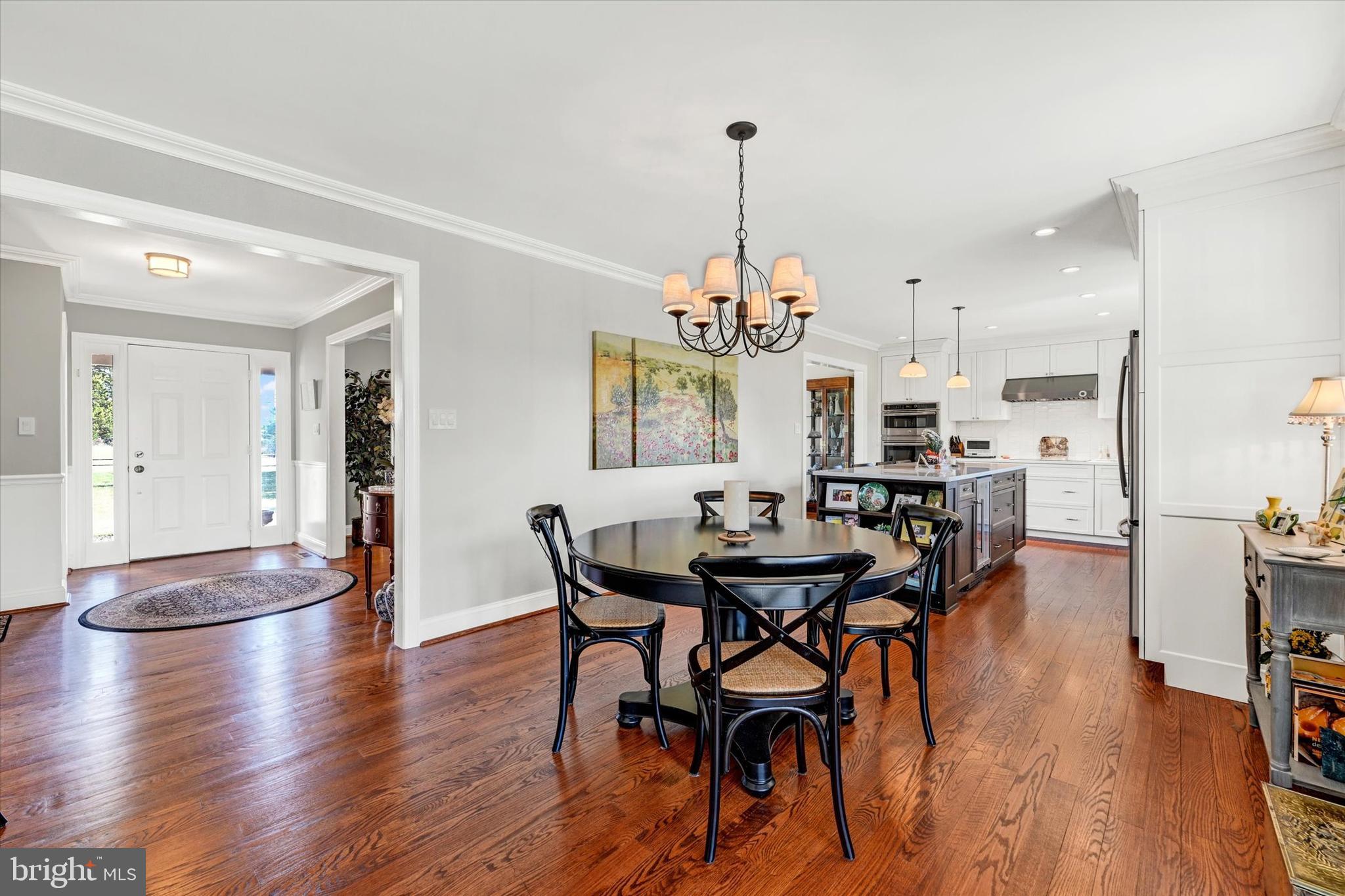 2211 Old Bosley Road Cockeysville, MD 21030 - Photo 13 of 65 a view of a dining room with furniture and wooden floor
