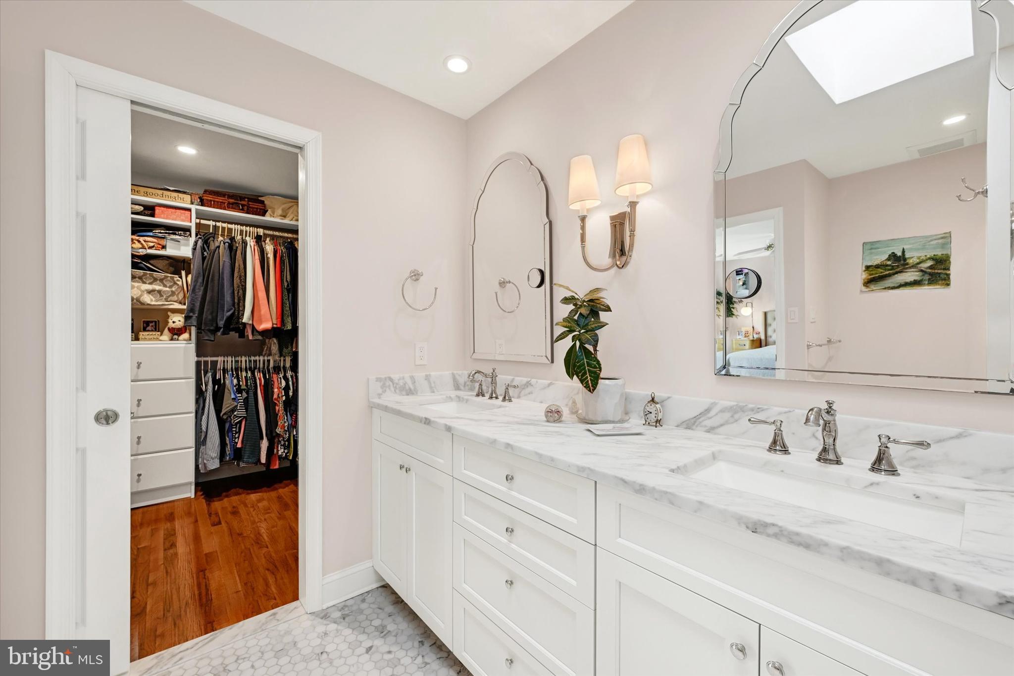 2211 Old Bosley Road Cockeysville, MD 21030 - Photo 18 of 65 a bathroom with a double vanity sink and a mirror