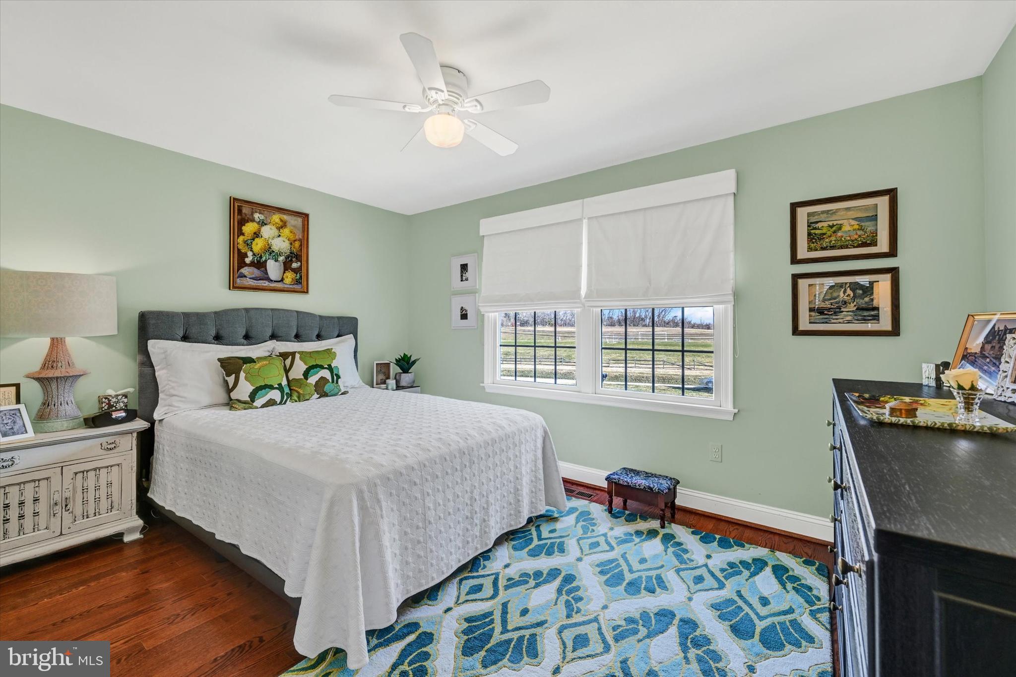 2211 Old Bosley Road Cockeysville, MD 21030 - Photo 21 of 65 a bedroom with a bed and a table in it with window