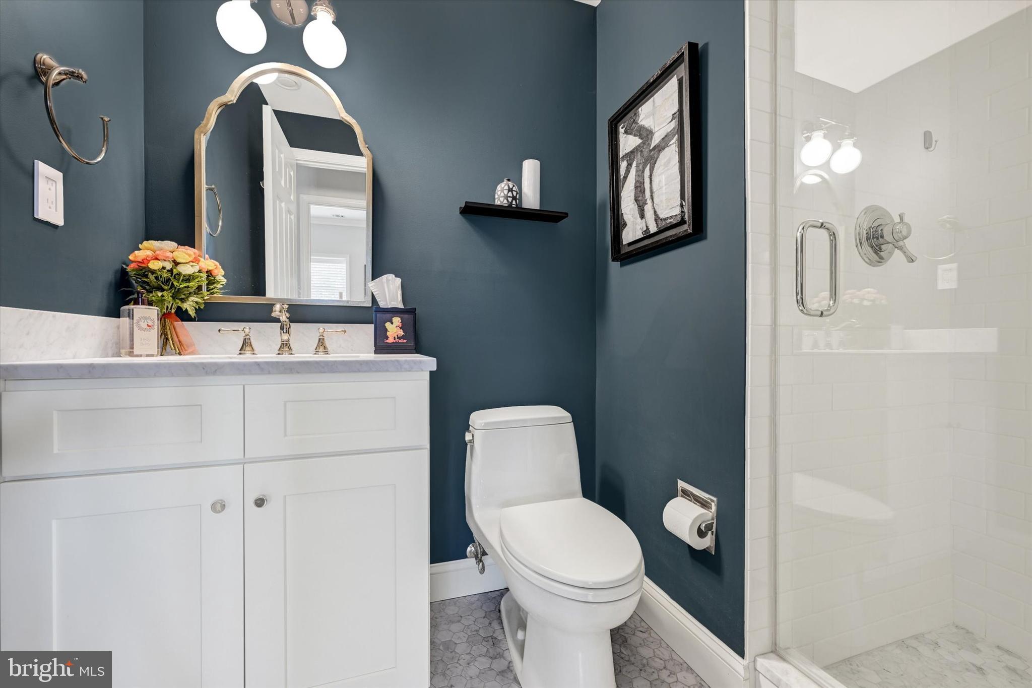2211 Old Bosley Road Cockeysville, MD 21030 - Photo 32 of 65 a bathroom with a toilet sink and mirror