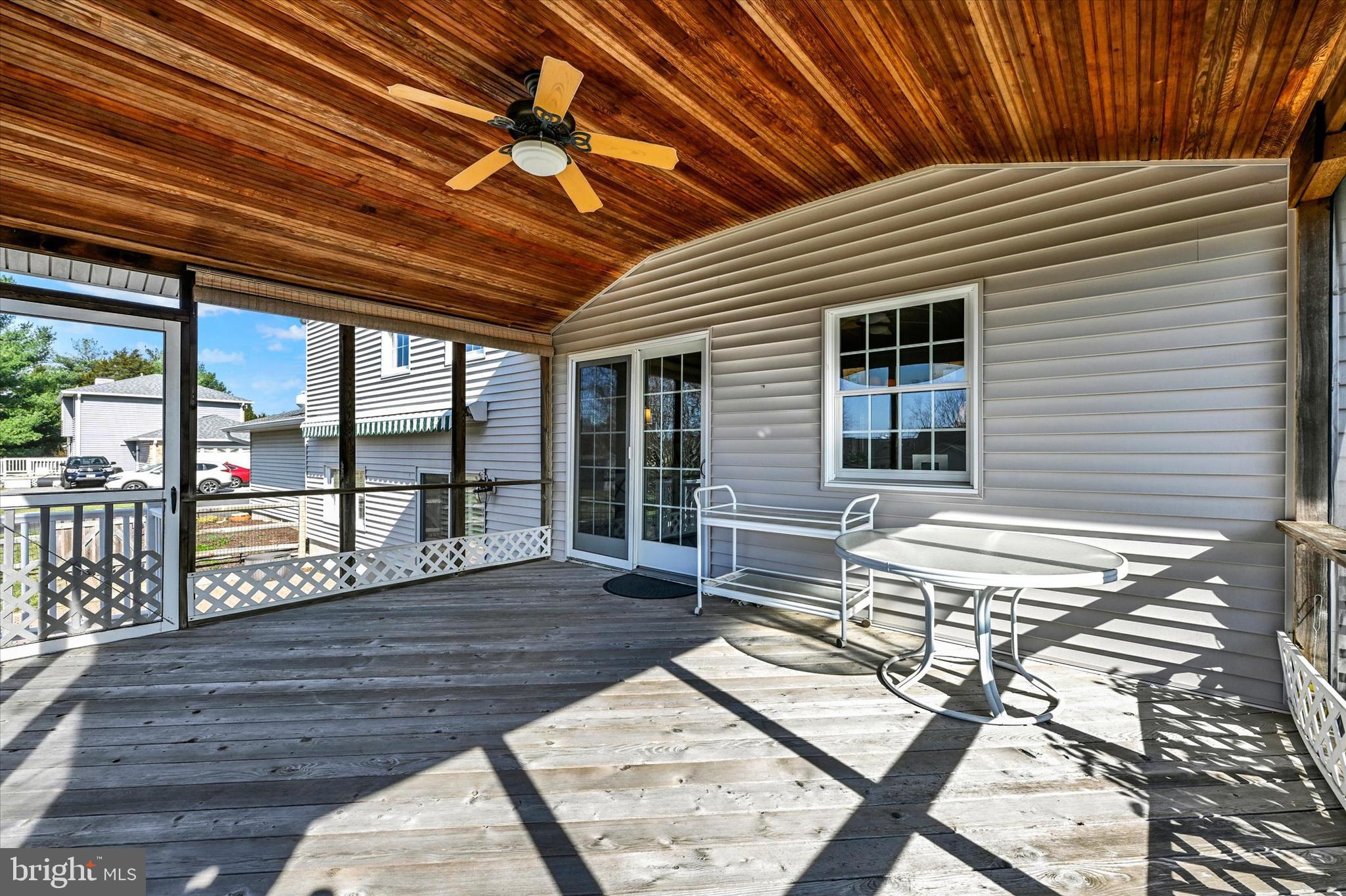 2211 Old Bosley Road Cockeysville, MD 21030 - Photo 42 of 65 a balcony with couch and wooden floor