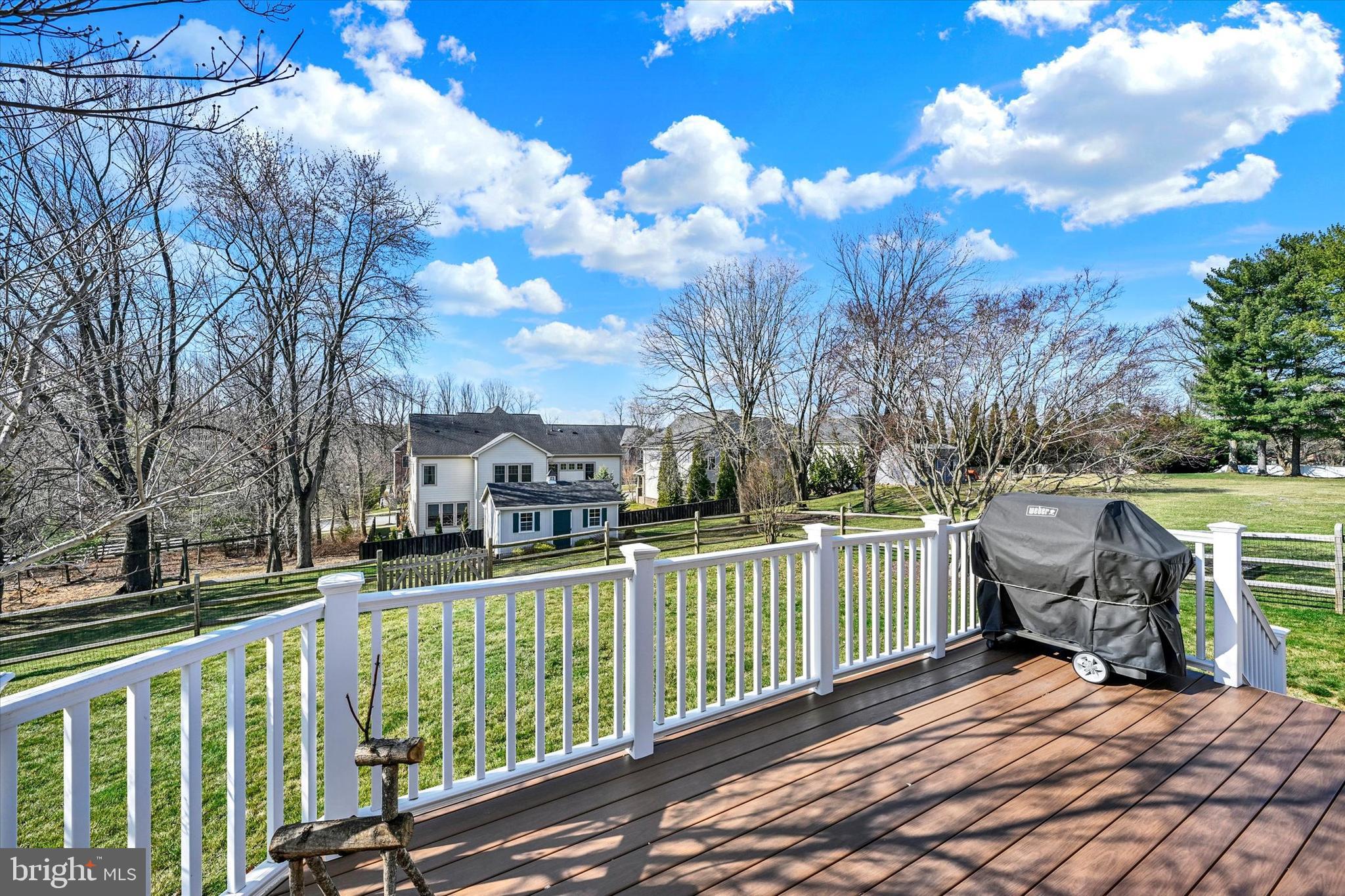 2211 Old Bosley Road Cockeysville, MD 21030 - Photo 43 of 65 a view of a building with a bench in a yard