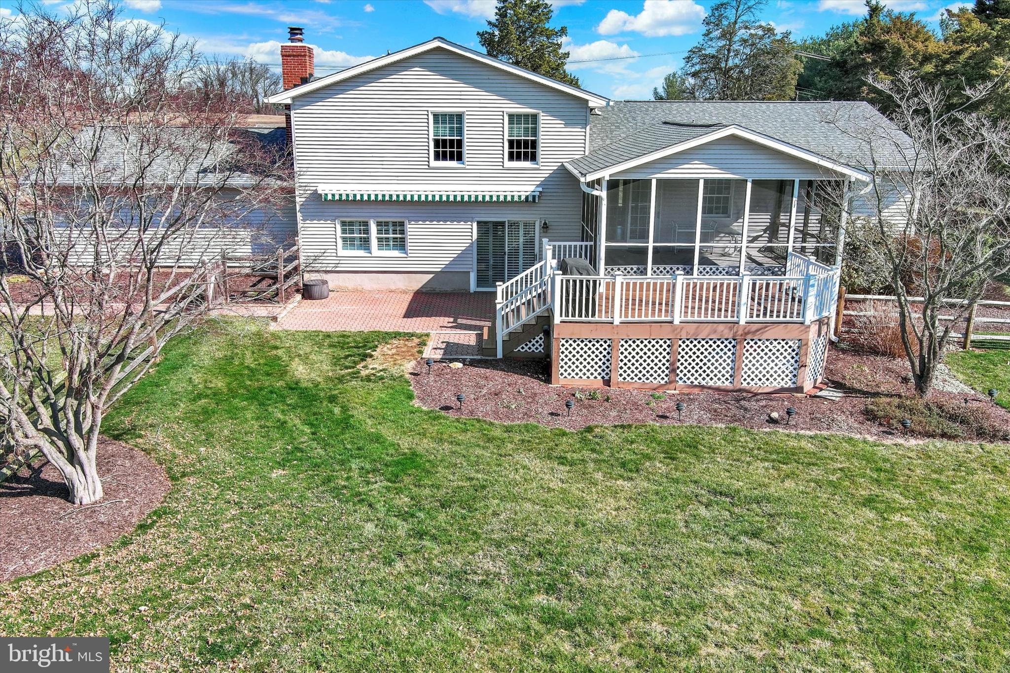 2211 Old Bosley Road Cockeysville, MD 21030 - Photo 52 of 65 a front view of a house with a garden