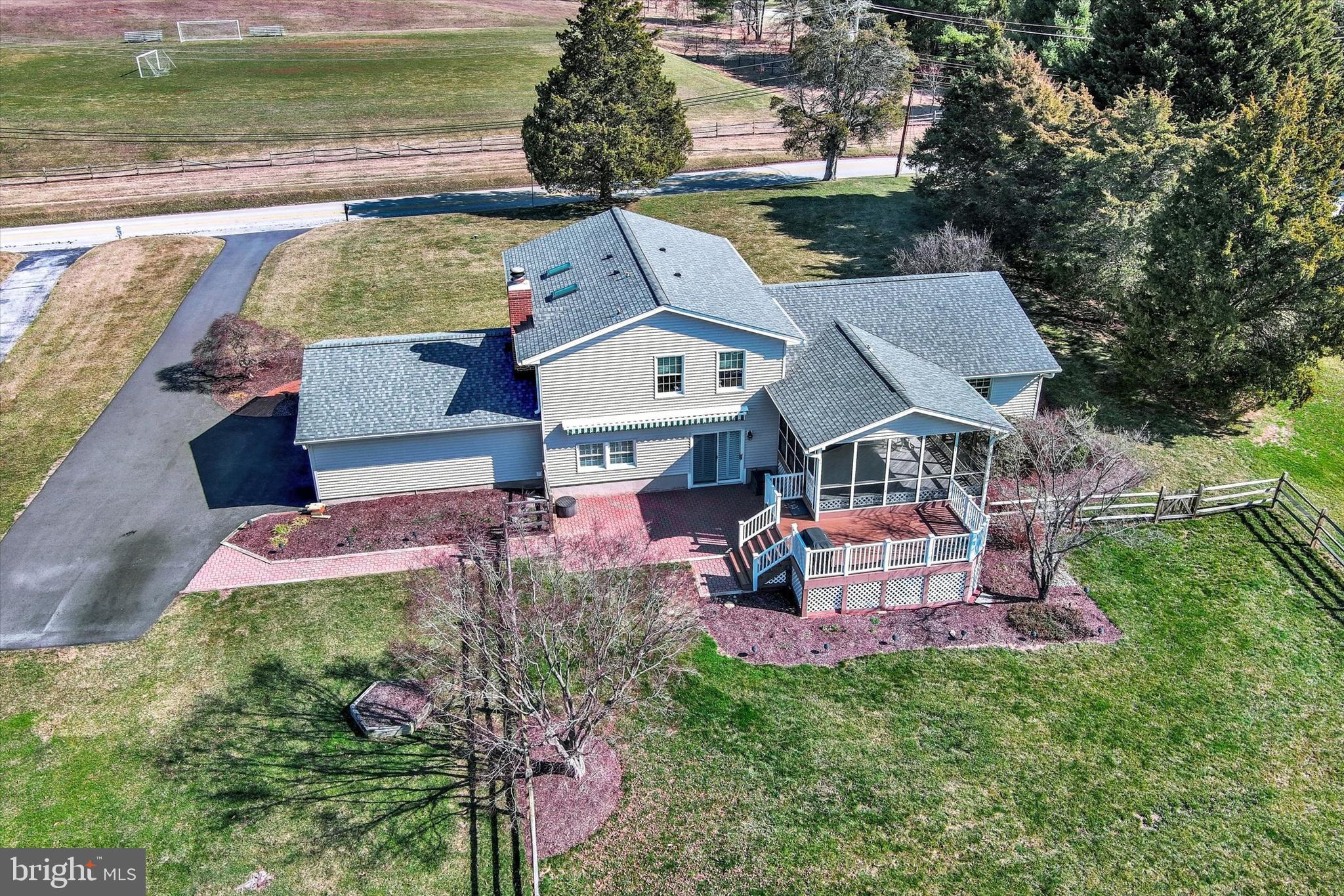 2211 Old Bosley Road Cockeysville, MD 21030 - Photo 54 of 65 an aerial view of a house with a garden and lake view