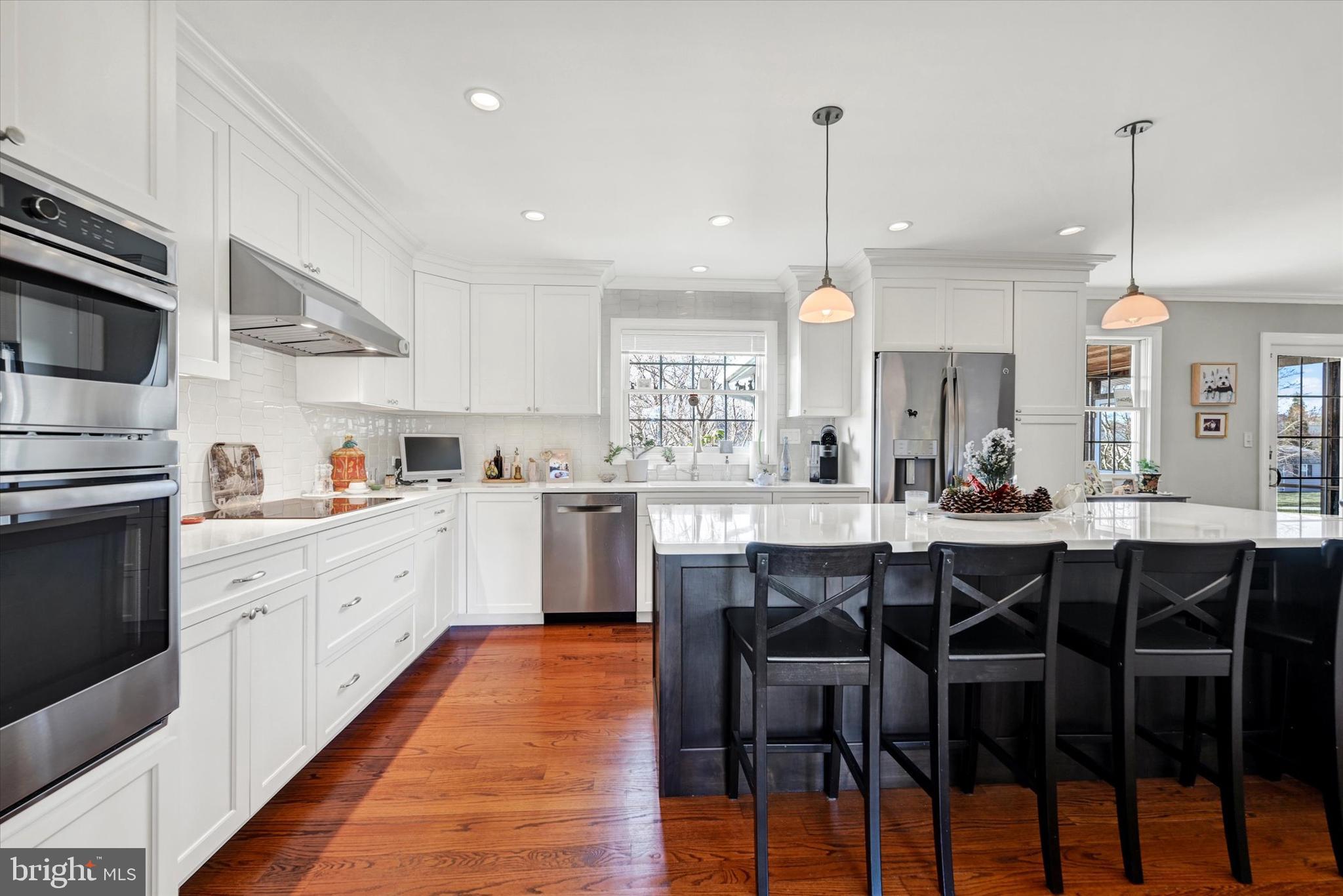 2211 Old Bosley Road Cockeysville, MD 21030 - Photo 9 of 65 a large kitchen with lots of counter space dining table and chairs