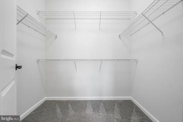 a bathroom with a tub a sink and mirror