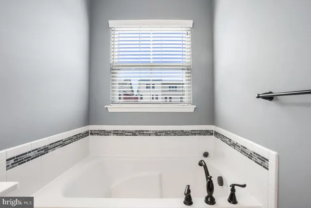a bathroom with a sink vanity and a mirror