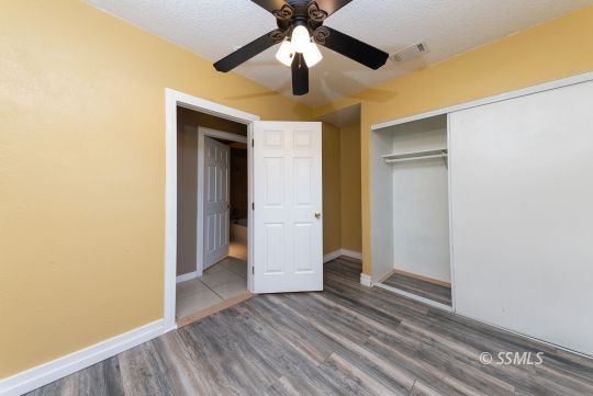 231 North Kern Street Ridgecrest, CA 93555 - Photo 10 of 41 a view of empty room with wooden floor
