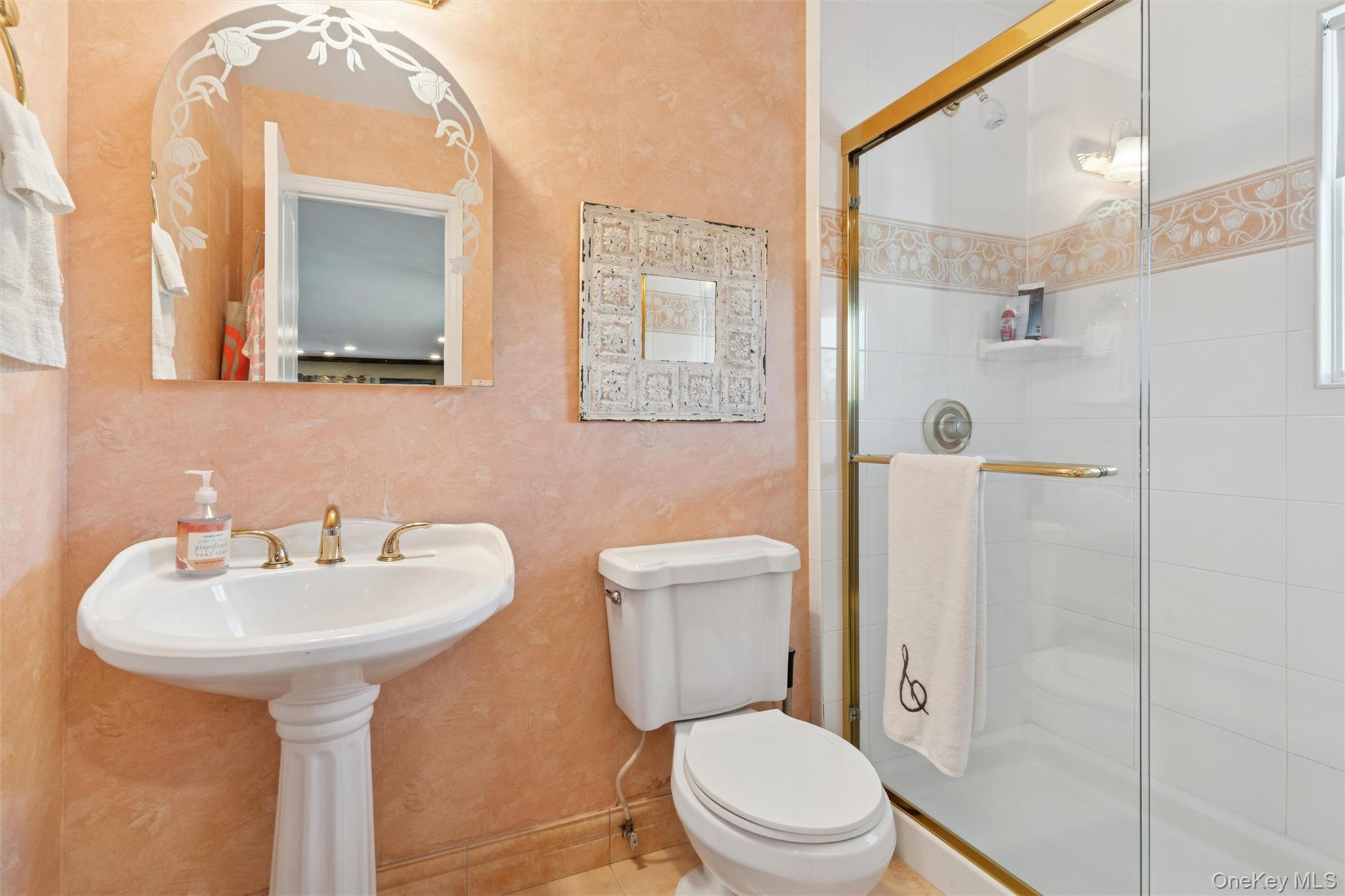 2858 Shore Road Bellmore, NY 11710 - Photo 20 of 38 a bathroom with a sink toilet and shower