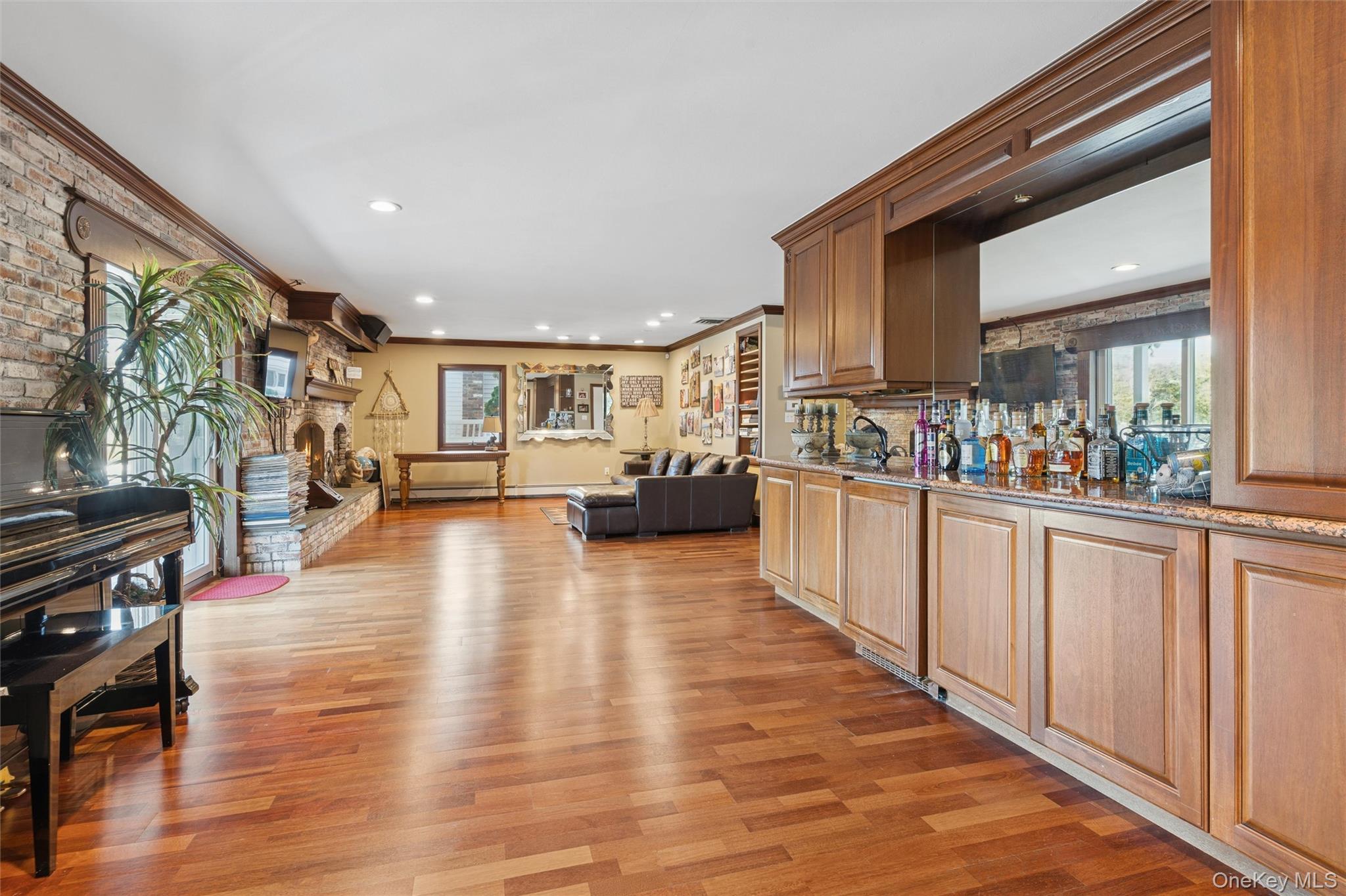2858 Shore Road Bellmore, NY 11710 - Photo 24 of 38 a open kitchen with stainless steel appliances granite countertop a large counter top a stove and a wooden floors