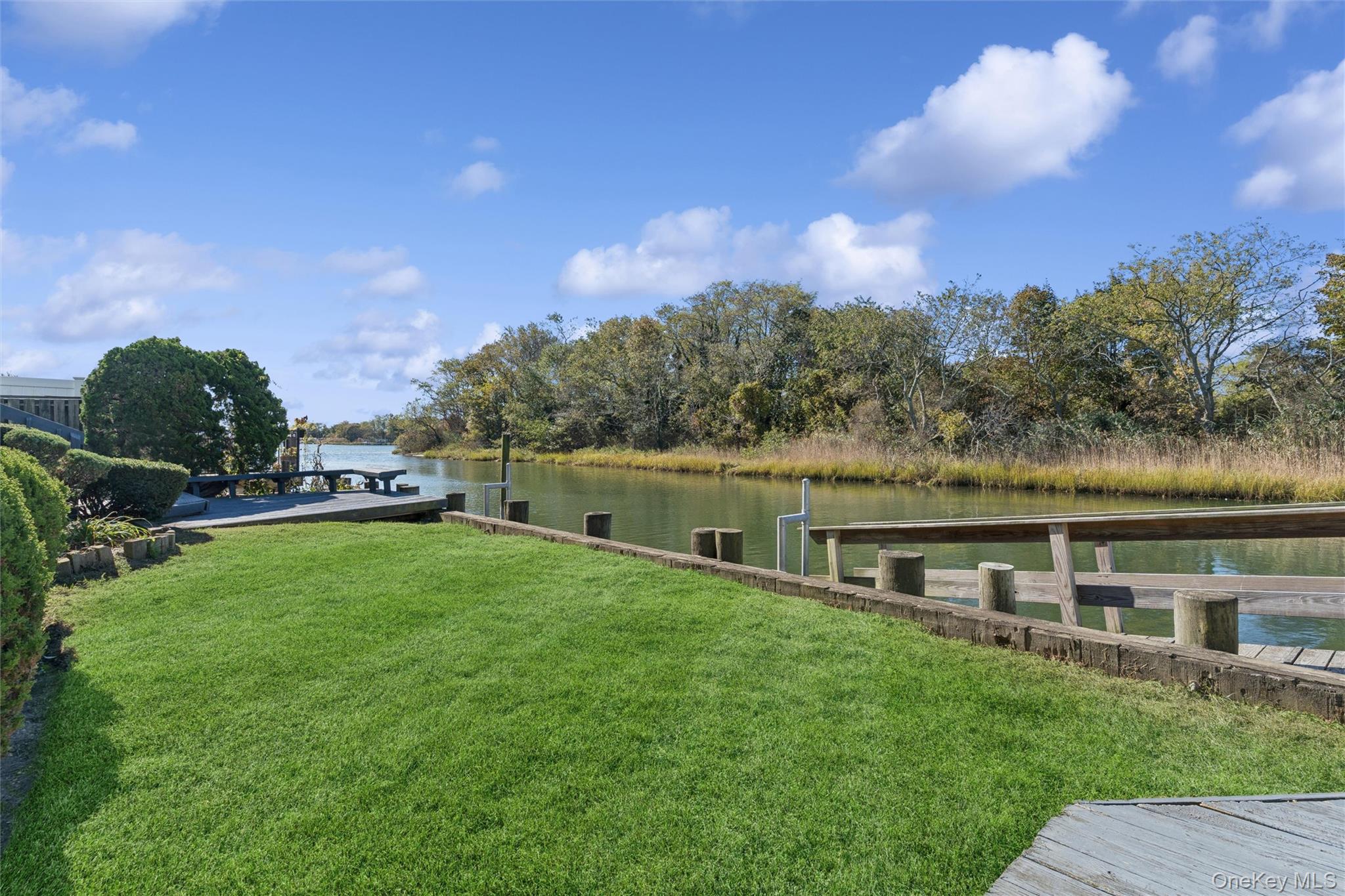 2858 Shore Road Bellmore, NY 11710 - Photo 27 of 38 a view of house with swimming pool and mountains in the background