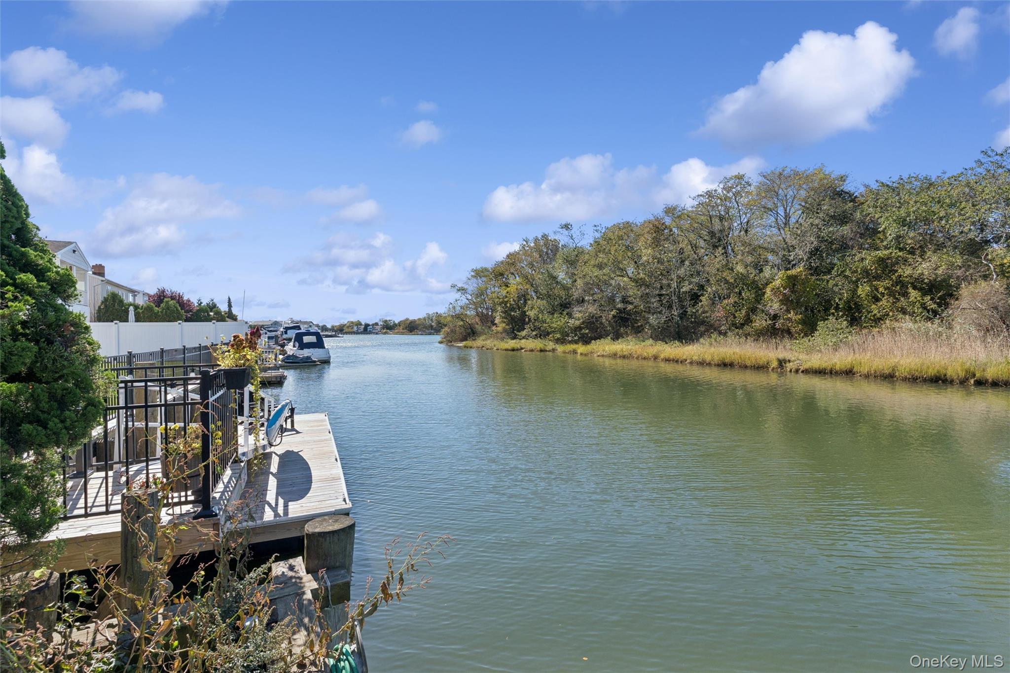 2858 Shore Road Bellmore, NY 11710 - Photo 28 of 38 a view of a lake with a table and chairs