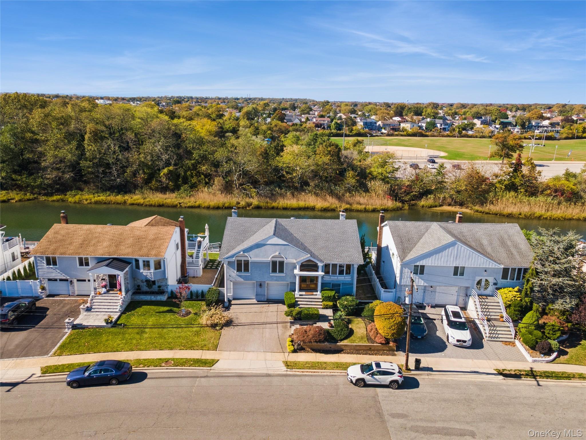 2858 Shore Road Bellmore, NY 11710 - Photo 32 of 38 an aerial view of a house with swimming pool and ocean view