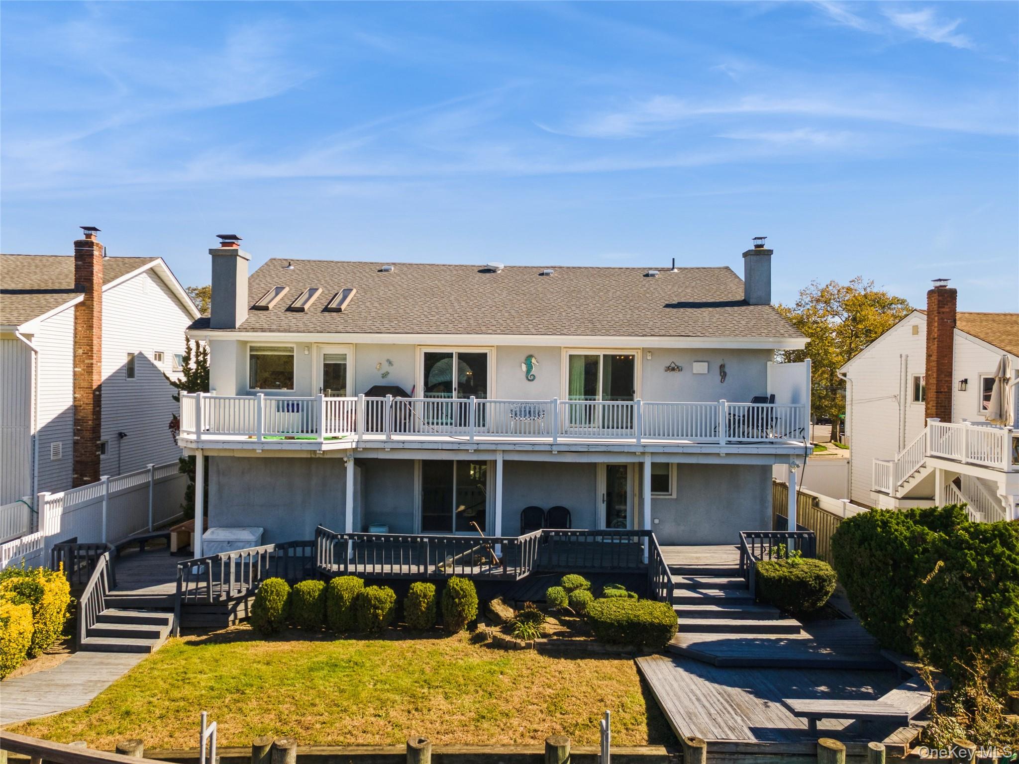 2858 Shore Road Bellmore, NY 11710 - Photo 33 of 38 a front view of a houses with yard