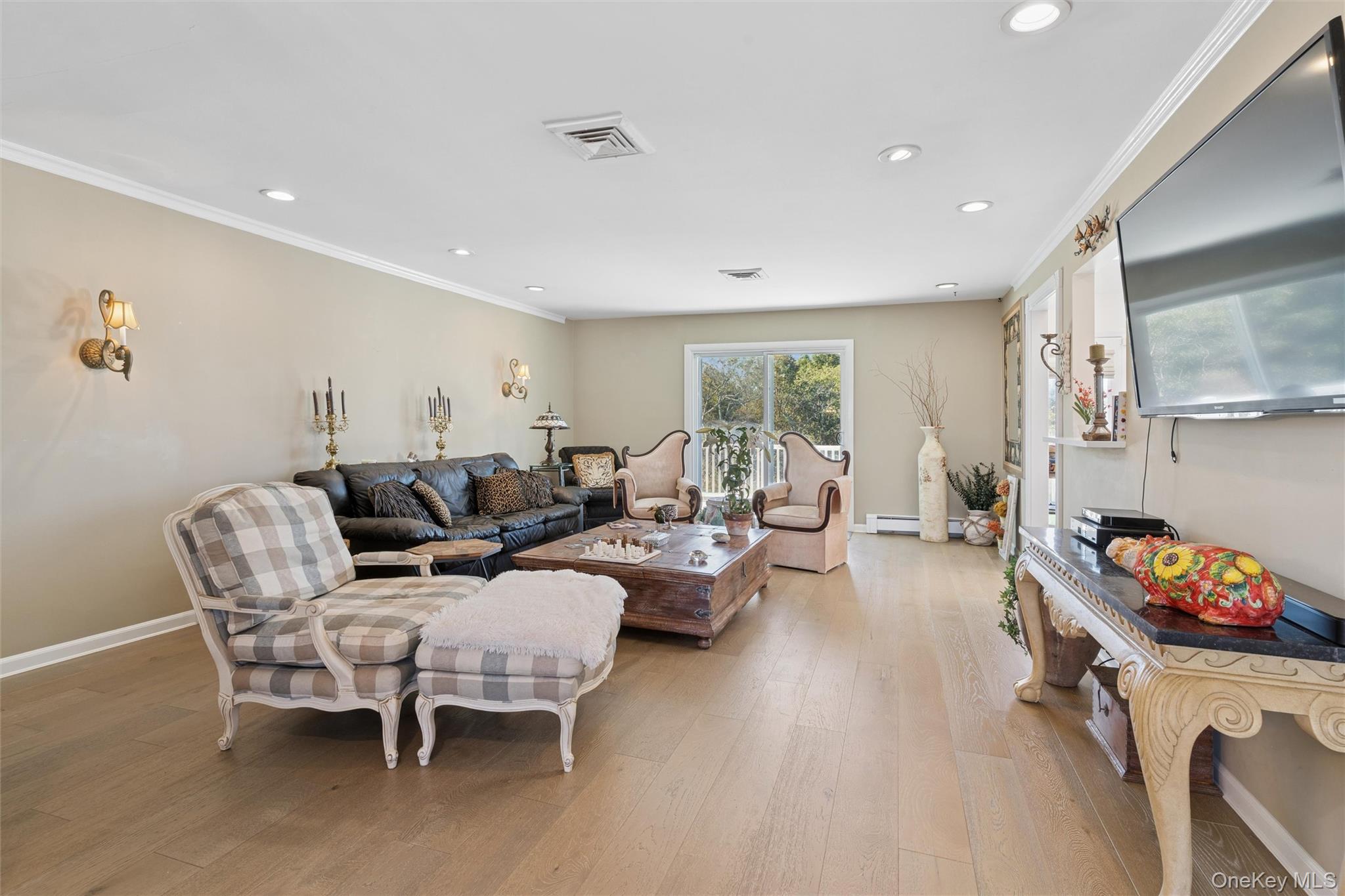 2858 Shore Road Bellmore, NY 11710 - Photo 4 of 38 a living room with furniture and a wooden floor