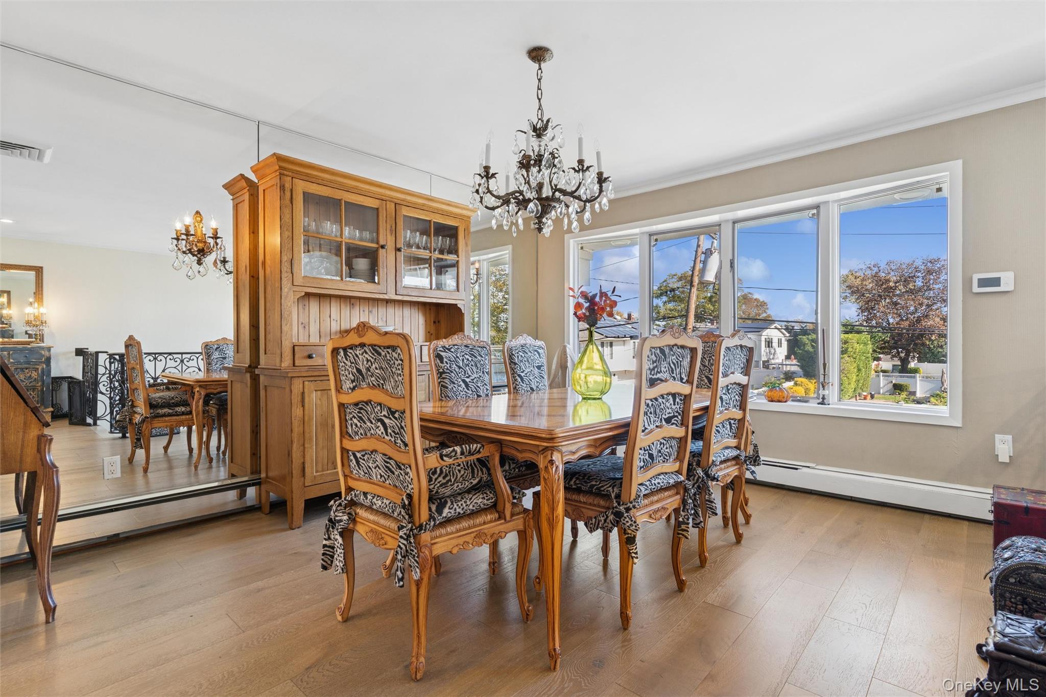 2858 Shore Road Bellmore, NY 11710 - Photo 7 of 38 a view of a dining room with furniture window and wooden floor