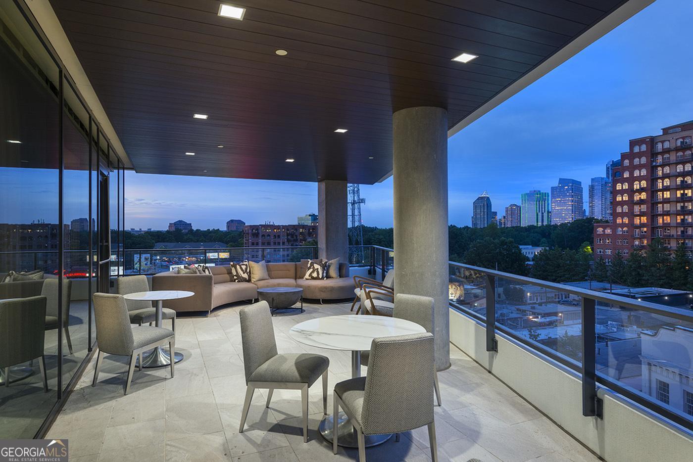 3150 Roswell Road Northwest, Unit 620 Atlanta, GA 30305 - Photo 19 of 26 a outdoor living space with patio furniture and a potted plant