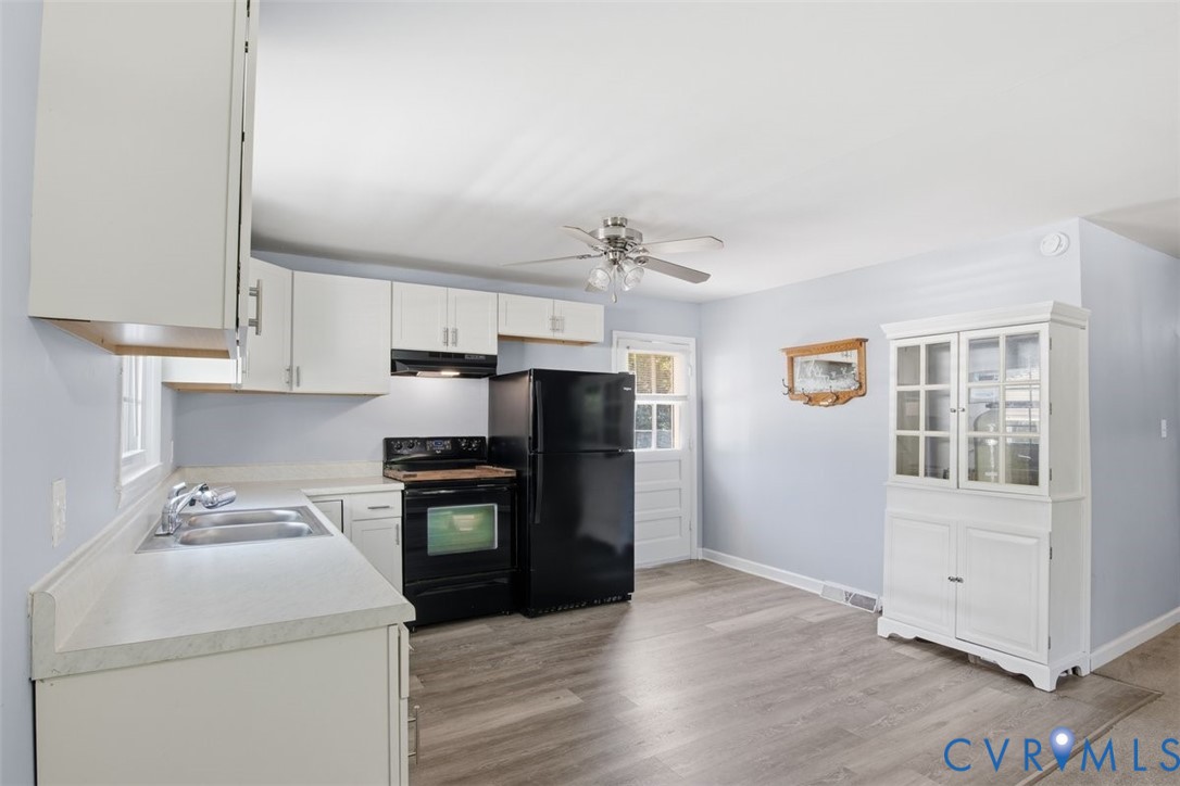 15503 Eppes Road Dewitt, VA 23840 - Photo 12 of 22 a kitchen with a stove cabinets and a refrigerator