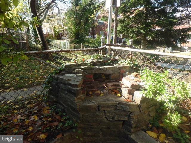 5528 Channing Road Baltimore, MD 21229 - Photo 8 of 13 a view of yard with tree in it