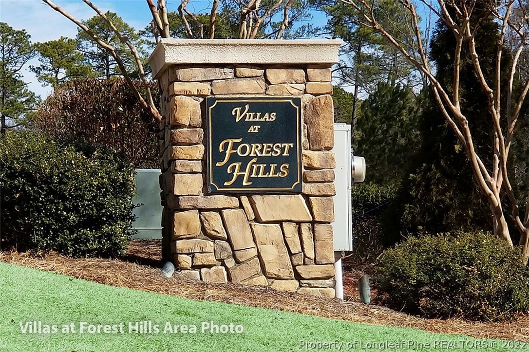 75 Winged Foot Road Pinehurst, NC 28374 - Photo 2 of 12 a sign on the side of a road