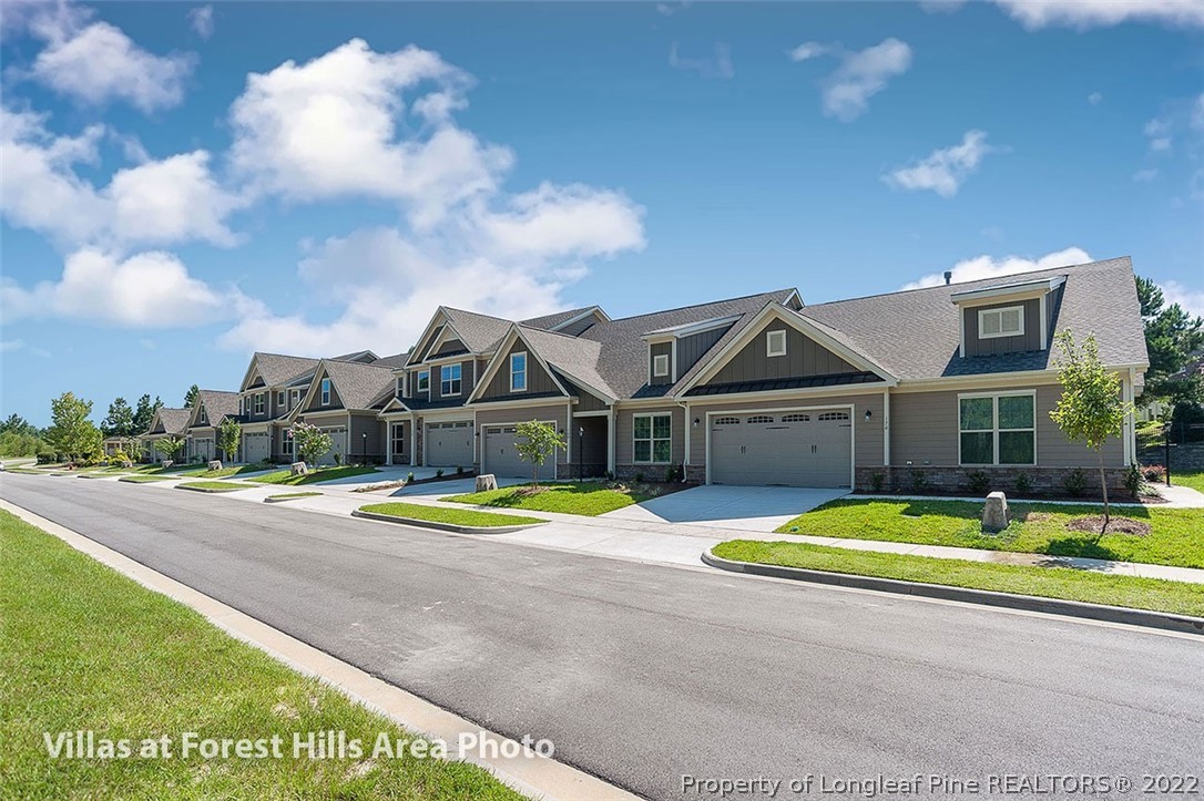 75 Winged Foot Road Pinehurst, NC 28374 - Photo 6 of 12 a view of a house with pool and a yard