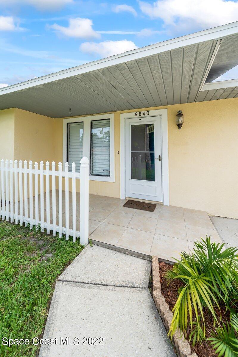 6840 Cairo Road Cocoa, FL 32927 - Photo 3 of 26 a view of a house with a garden
