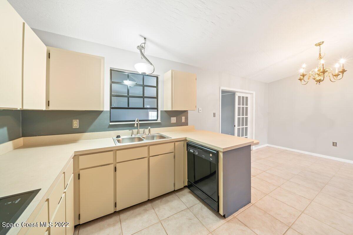 6840 Cairo Road Cocoa, FL 32927 - Photo 7 of 26 a kitchen with a sink and cabinets