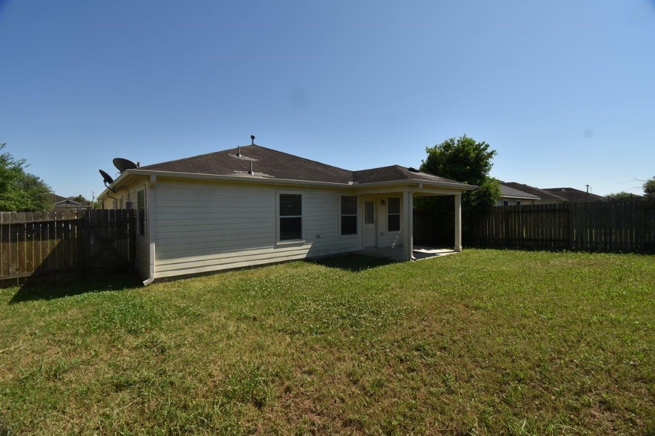 1126 Desert Oasis Lane Rosenberg, TX 77471 - Photo 15 of 16 a front view of house with yard and green space