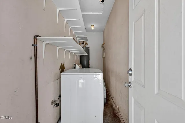 a view of a porch with a table and chairs
