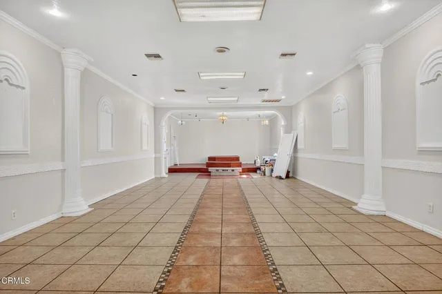 a view of a hallway with windows