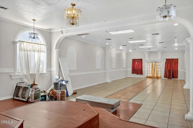 a room with a couch and wooden floor