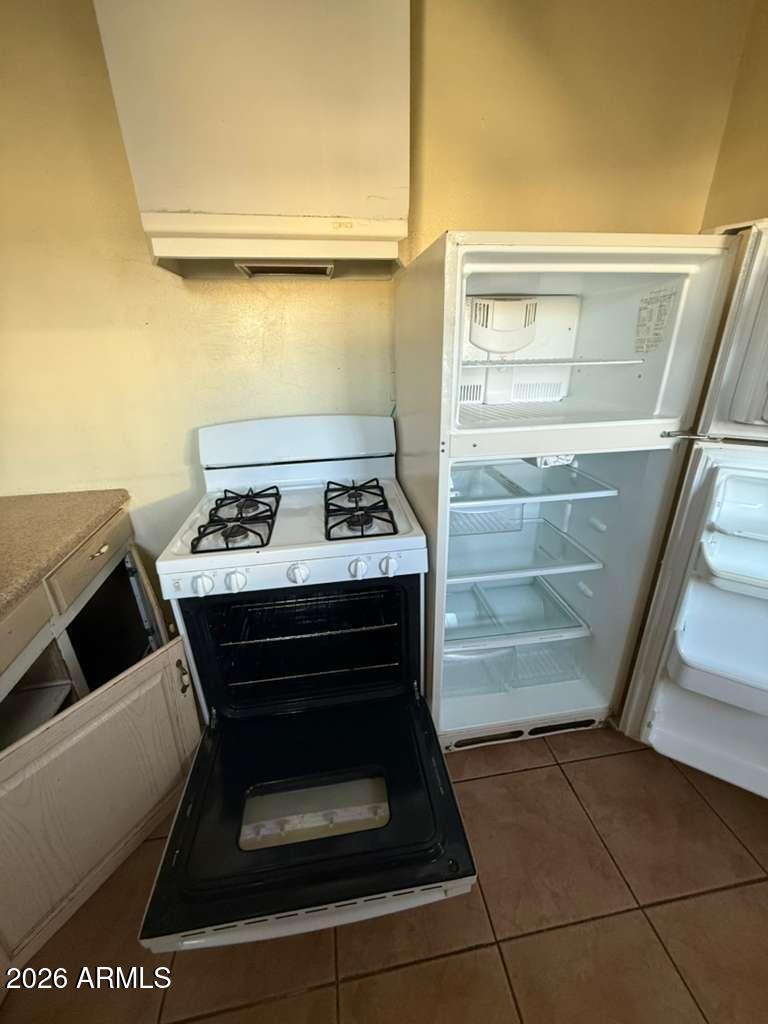 716 11th Street Douglas, AZ 85607 - Photo 13 of 26 a bathroom with a sink and a mirror