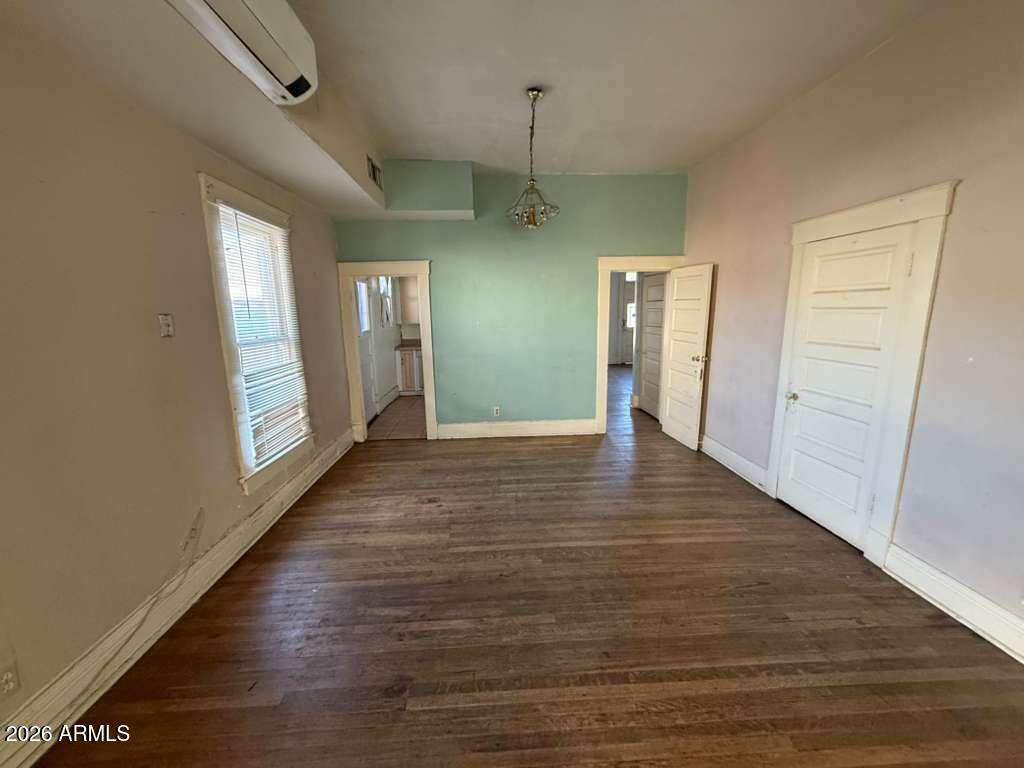 716 11th Street Douglas, AZ 85607 - Photo 7 of 26 a view of a hallway with wooden floor and stairs