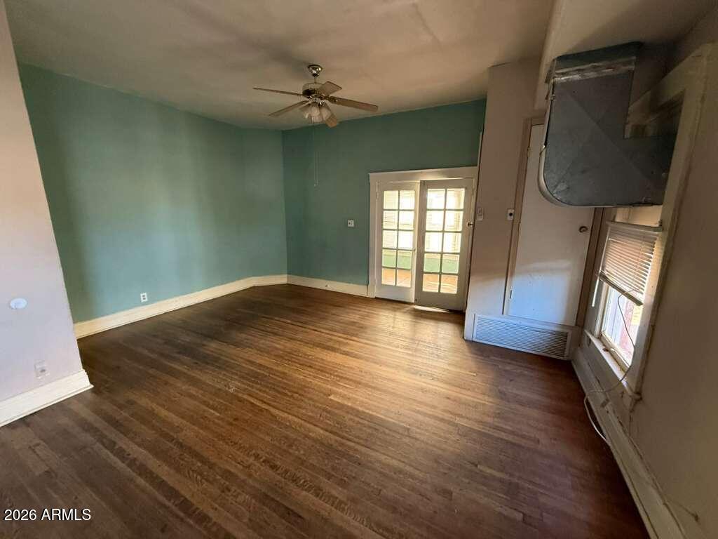716 11th Street Douglas, AZ 85607 - Photo 8 of 26 wooden floor in an empty room with a window