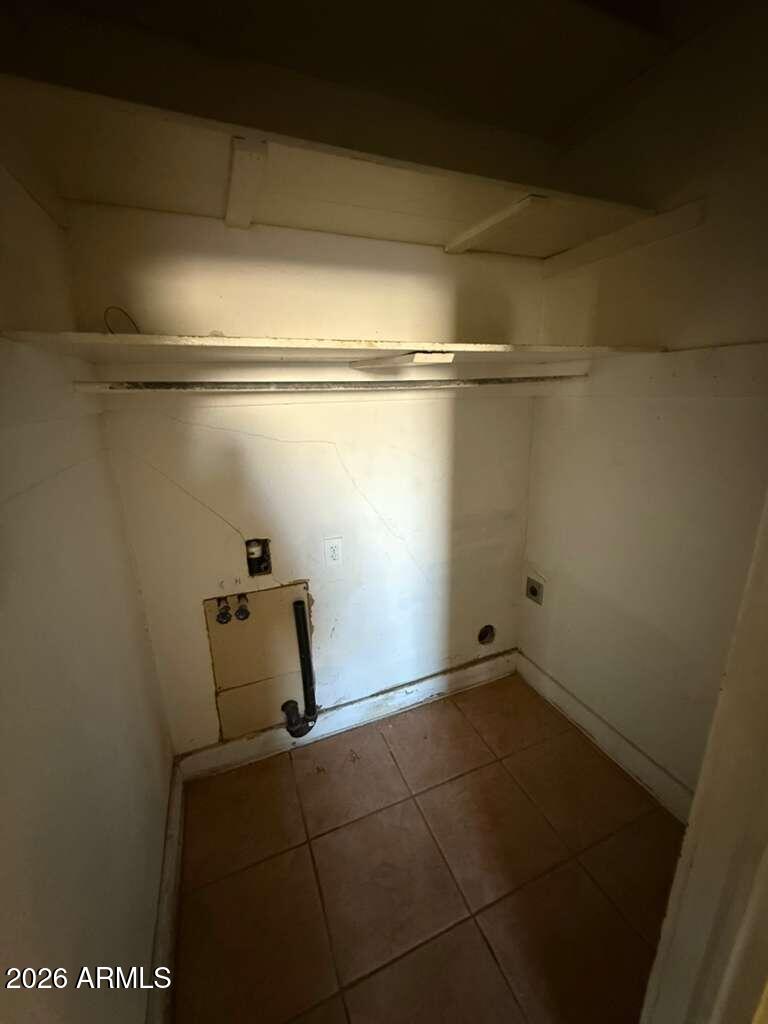 716 11th Street Douglas, AZ 85607 - Photo 9 of 26 a view of a room with racks on the wall