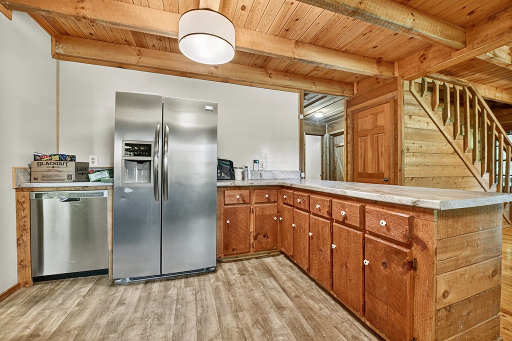 28.65 Jolley Way Epworth, GA 30541 - Photo 13 of 55 a kitchen with stainless steel appliances granite countertop a refrigerator and a stove